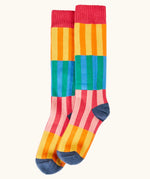 Frugi GOTS organic cotton socks showing   colourful striped design and a navy heel and toe and coral ankle cuff 