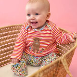 Frugi Brooke easy-dressing babygrow in pink stripes with Highland cow applique and floral footed bottoms.