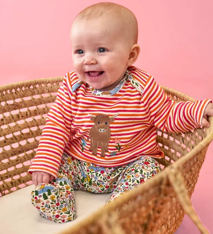 Frugi Brooke easy-dressing babygrow in pink stripes with Highland cow applique and floral footed bottoms.