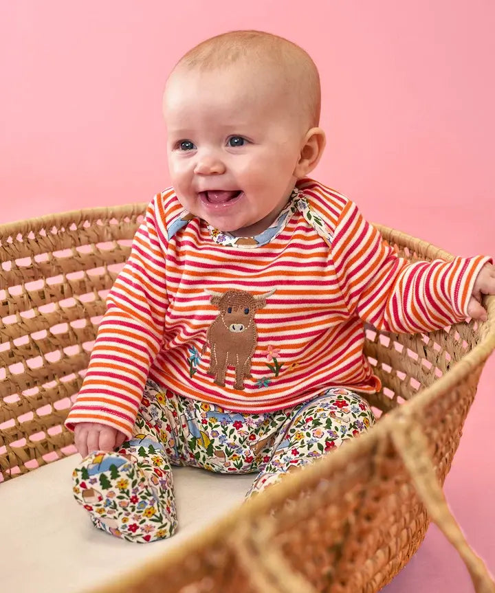 Frugi Brooke easy-dressing babygrow in pink stripes with Highland cow applique and floral footed bottoms.