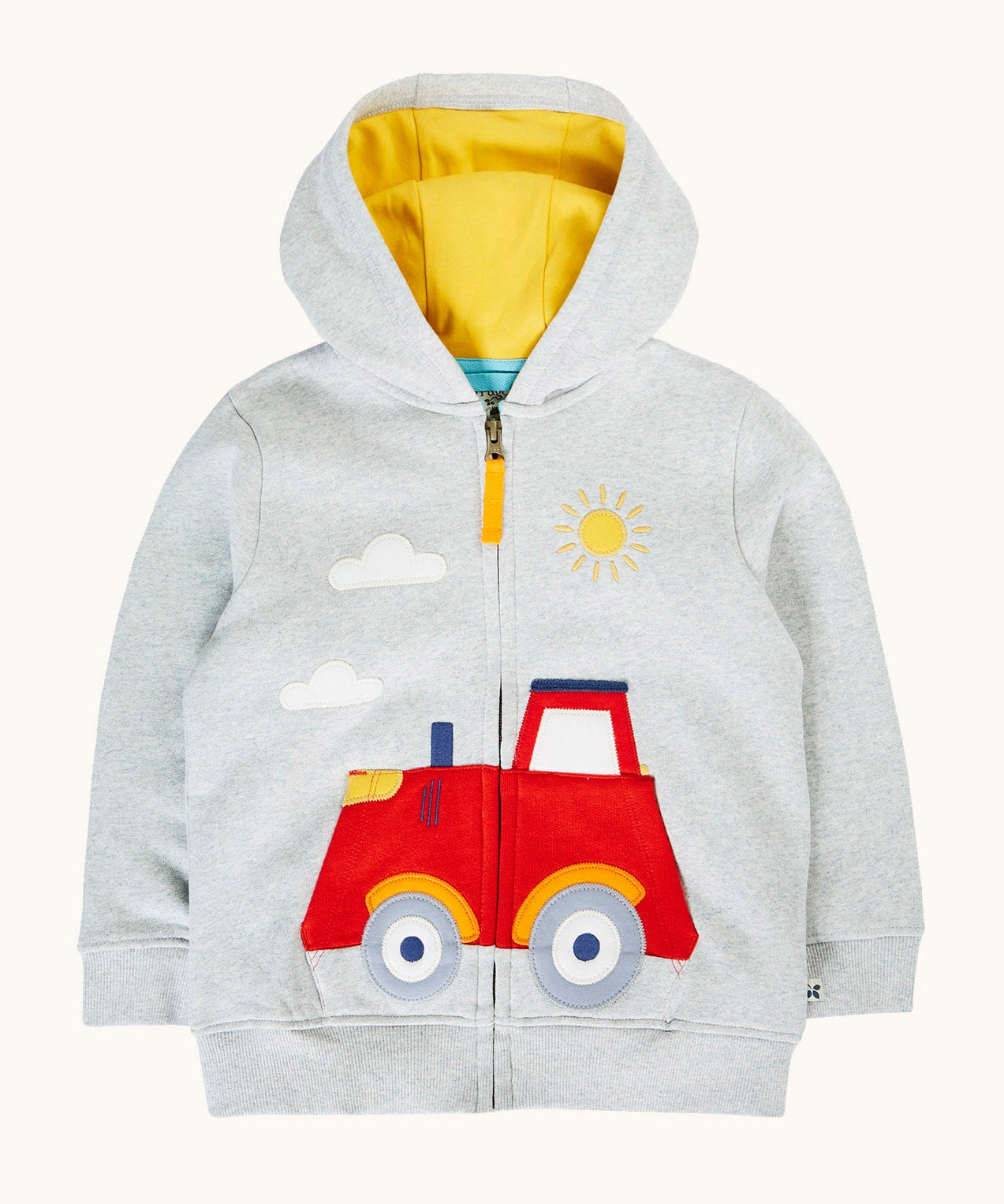 Frugi organic cotton hoodie laid flat. In light grey with a yellow inner lining. Has a red tractor on the bottom with a full length zip