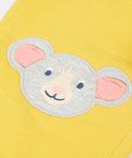 Frugi GOTS 100% organic cotton joggers in yellow showing a close up of the  cute mouse applique on the knee