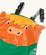 Frugi holly/green cow character puddle buster trousers laid flat showing a close up of the elasticated shoulder straps and highland cow panel