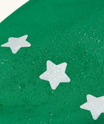 Frugi holly green/cow character puddle buster trousers showing water beading near the star reflective patches on the leg