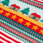 A closer look at the Christmas tree, house and star print on the chest of the Frugi Lumi Knitted Romper - Fairisle Christmas Stripe