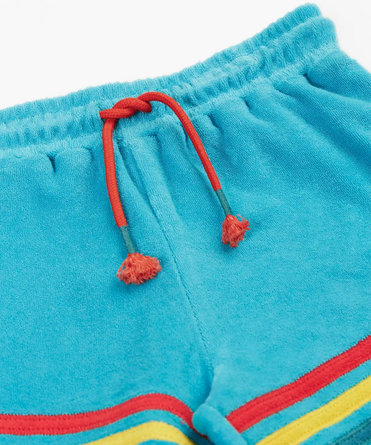 Frugi GOTS organic cotton coast towelling shorts in light blue laid flat showing the red waist cord