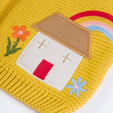 Frugi kids knitted cardigan in yellow laid flat showing a close up of the cute house applique and flower embroidery on organic cotton fabric