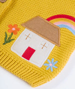 Frugi kids knitted cardigan in yellow laid flat showing a close up of the cute house applique and flower embroidery on organic cotton fabric