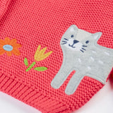 Frugi kids knitted cardigan in soft pink laid flat showing a close up of the cute cat applique on organic cotton fabric