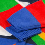 The colourblock sleeves on the Frugi Corin Knitted Cardigan - Blue Tang/Rocket Flight, in blue, red and green