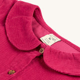 The cord detail, buttons and collar on the Frugi Coco Cord Dress - Lingonberry/Squirrel