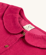 The cord detail, buttons and collar on the Frugi Coco Cord Dress - Lingonberry/Squirrel