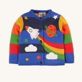 This long-sleeved Corin Knitted Cardigan from Frugi, made from soft organic cotton, In a Rocket Flight design, this cardigan has stretchy rib cuffs and button fastenings running down the front. The print has colourblock stripes, a rocket, stars, a planet and clouds, continued on the back of the cardigan.
