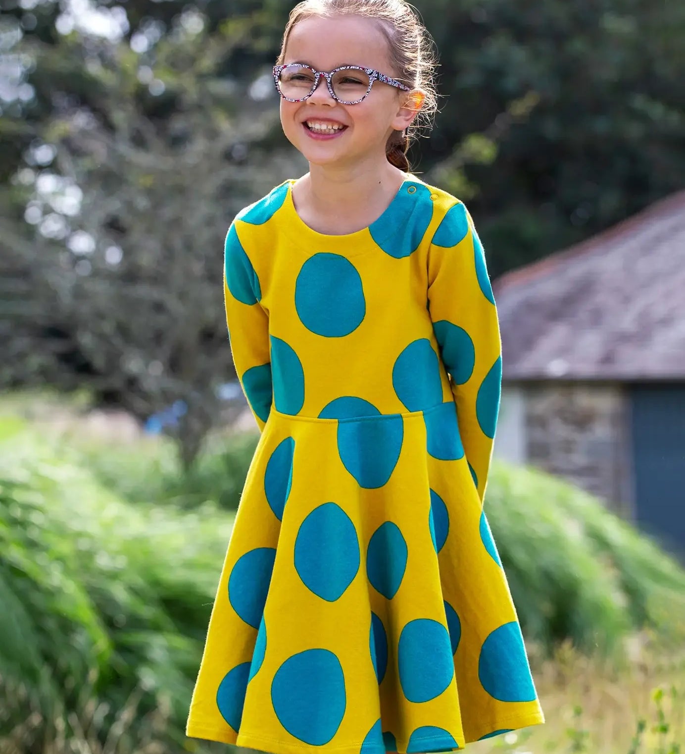 Frugi Cosy Skater Dress in yellow and blue Super Spot with long sleeves, made from organic cotton.