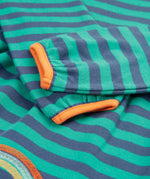 A closer look at the striped sleeves and orange detail on the Frugi Dolcie Dress - Iguana Stripe/Tiger