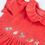 A closer look at the frill collar and robin embroidery on the front of the Frugi Amilie Party Dress - True Red/Robin