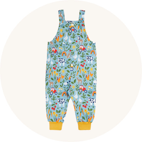 Frugi Parsnip Dungarees in a pale grey/blue with all over farm print, made from organic cotton, to represent Frugi dungarees at Babipur.
