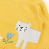 Frugi kids jumper laid flat showing a close up of the cute cat and flower applique on the front on yellow organic cotton fabric