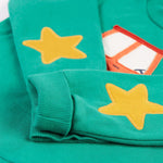 A closer look at the star applique patches on the sleeves of teh Frugi Easy On Jumper - Iguana/Tractor