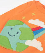 Frugi kids jumper laid flat showing a close up of the cute planet earth and star applique on the front on orange organic cotton fabric