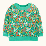 Frugi GOTS 100% organic cotton kids jumper in green with a repeating colourful floral design. Features elasticated cuffs, neck line and hem