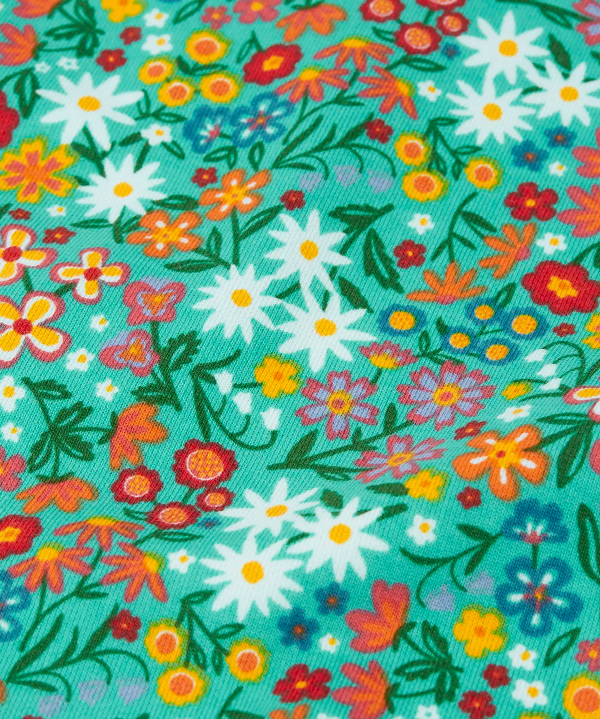 Frugi GOTS 100% organic cotton kids jumper in green showing a close up of the repeating colourful floral design