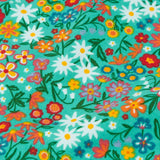 Frugi GOTS 100% organic cotton kids jumper in green showing a close up of the repeating colourful floral design