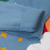 A close up of the turned up arm cuff on the Frugi elwood knitted jumper in dragon skies available at Babipur. 