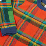 Frugi knitted kids jumper laid flat showing close up of the tartan design on organic cotton fabric