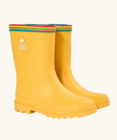 Frugi natural rubber, waterproof puddle buster wellingtons in yellow with a rainbow strip around the top