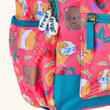 Frugi explorers backpack in guinea pig muddle showing the side pocket for holding a water bottle. 