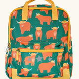 Frugi explorers backpack in green with a repeating highland cow design. Features a small front compartment and main compartment with yellow handle