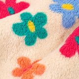 A closer look at the colourful flower pattern and cream fleece, on the Frugi Zipped Ted Fleece Jacket - Flower Pop