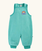 Frugi Flurry Fleece Dungarees in light teal Moss with elasticated cuffs and a 'do good things' chest emblem.