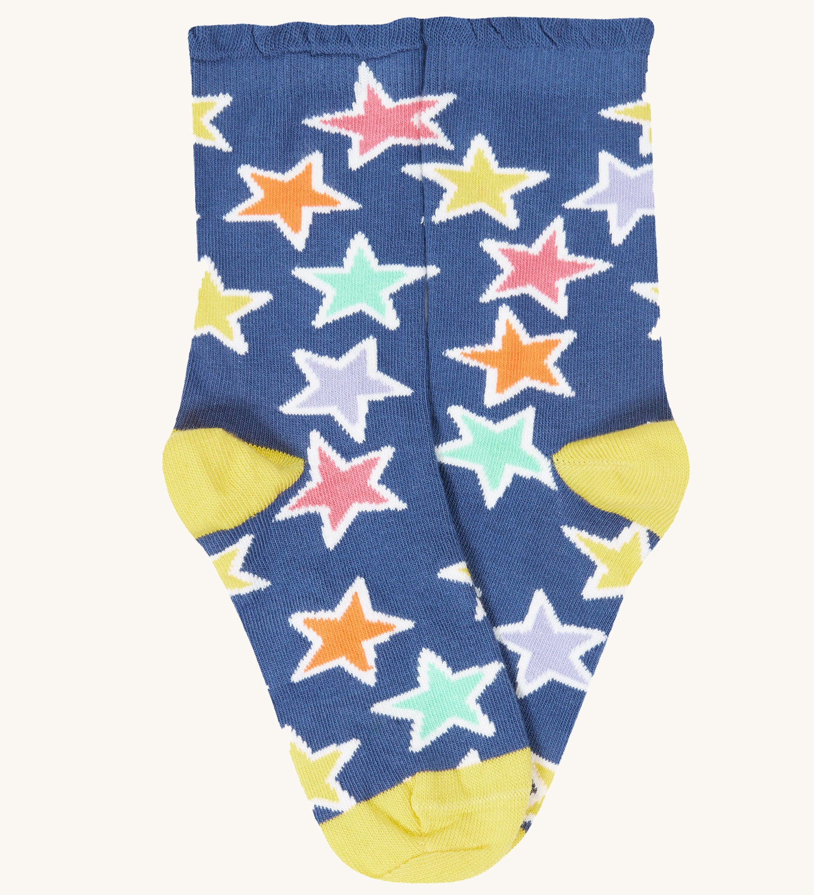 The blue with bold stars socks from the Frugi Frill Socks 2 Pack in stars available at Babipur. Sock features a gentle frill around the ankle and a yellow heel/toe panel