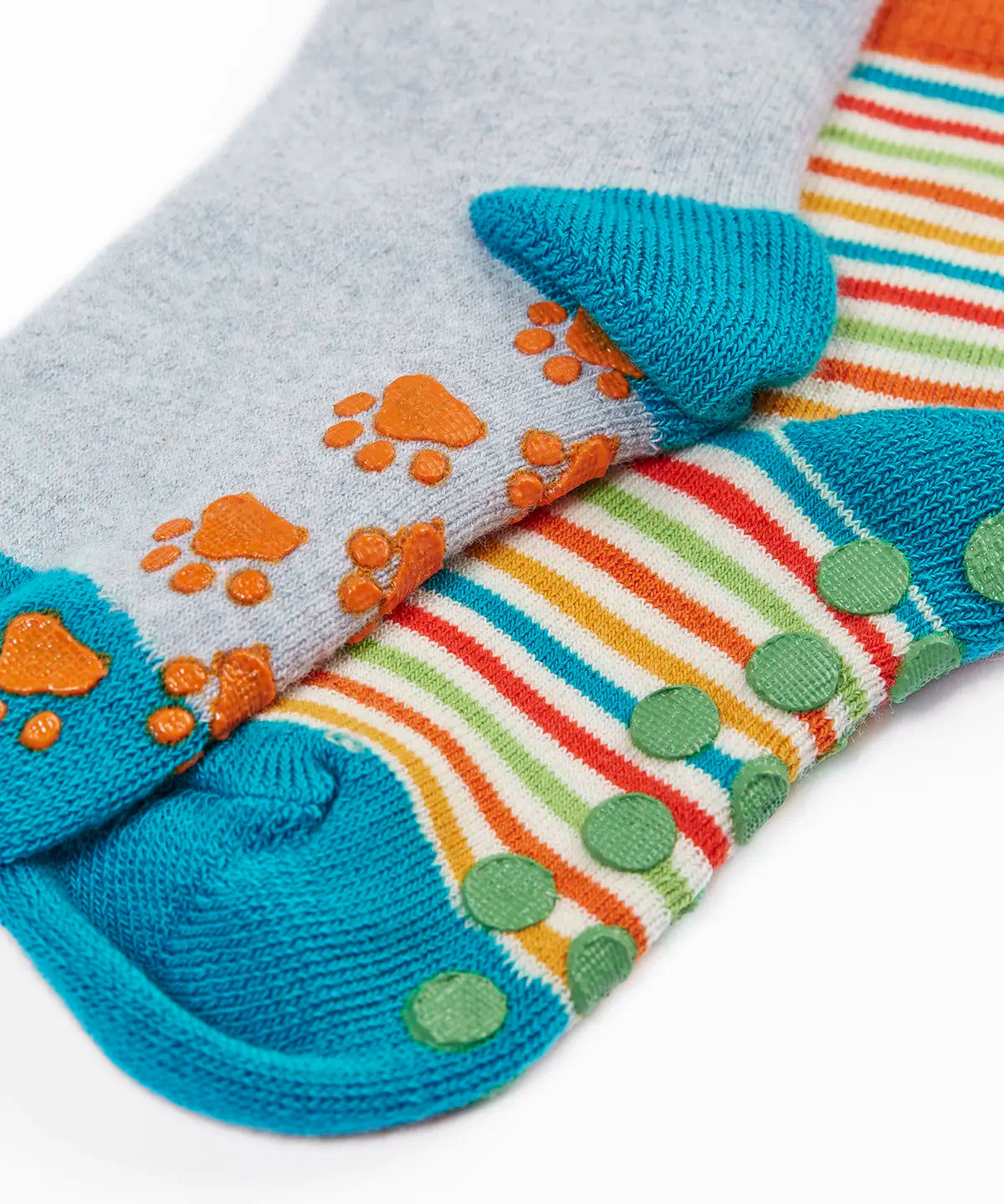 Frugi GOTS organic cotton fold over 2 pack socks in a colourful striped design and another in grey showing a close up of the grippy sole patches