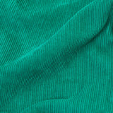 A closer look at the green cord of the Frugi Lacey Reversible Dungaree - Iguana/Autumn Friends