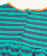 The back of the Frugi Dolcie Dress - Iguana Stripe/Tiger, showing the popper fasteners 
