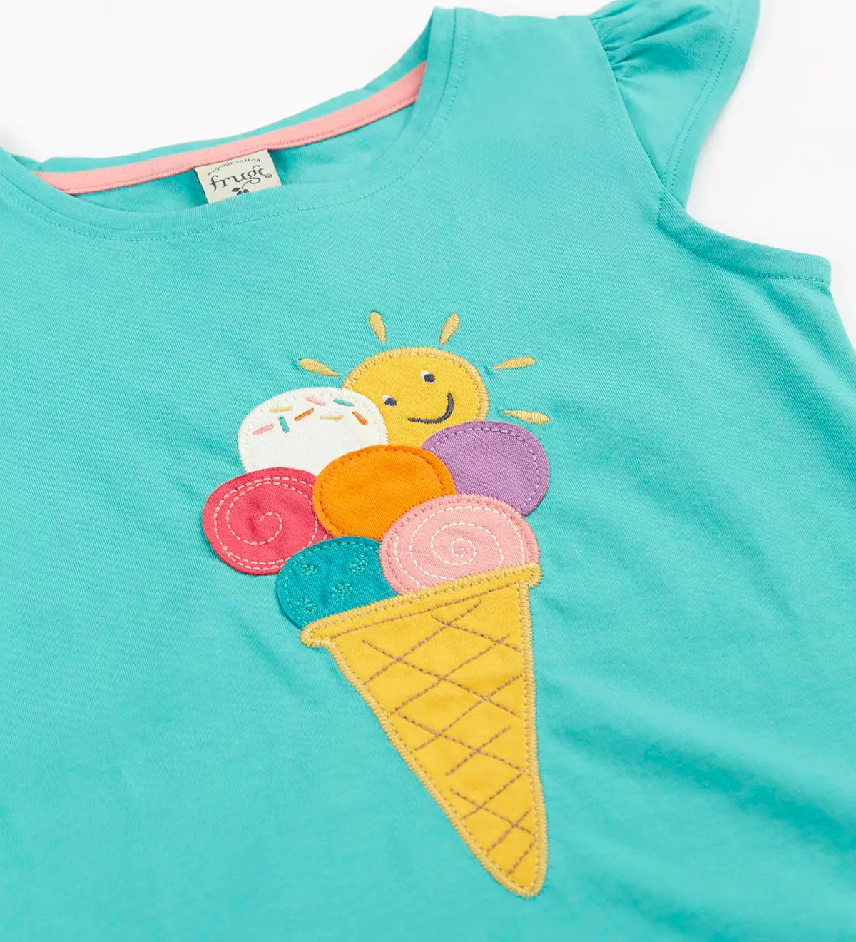 Frugi Harmony circular t-shirt in aqua laid flat showing the ice cream patch on the front and a frill on the shoulders