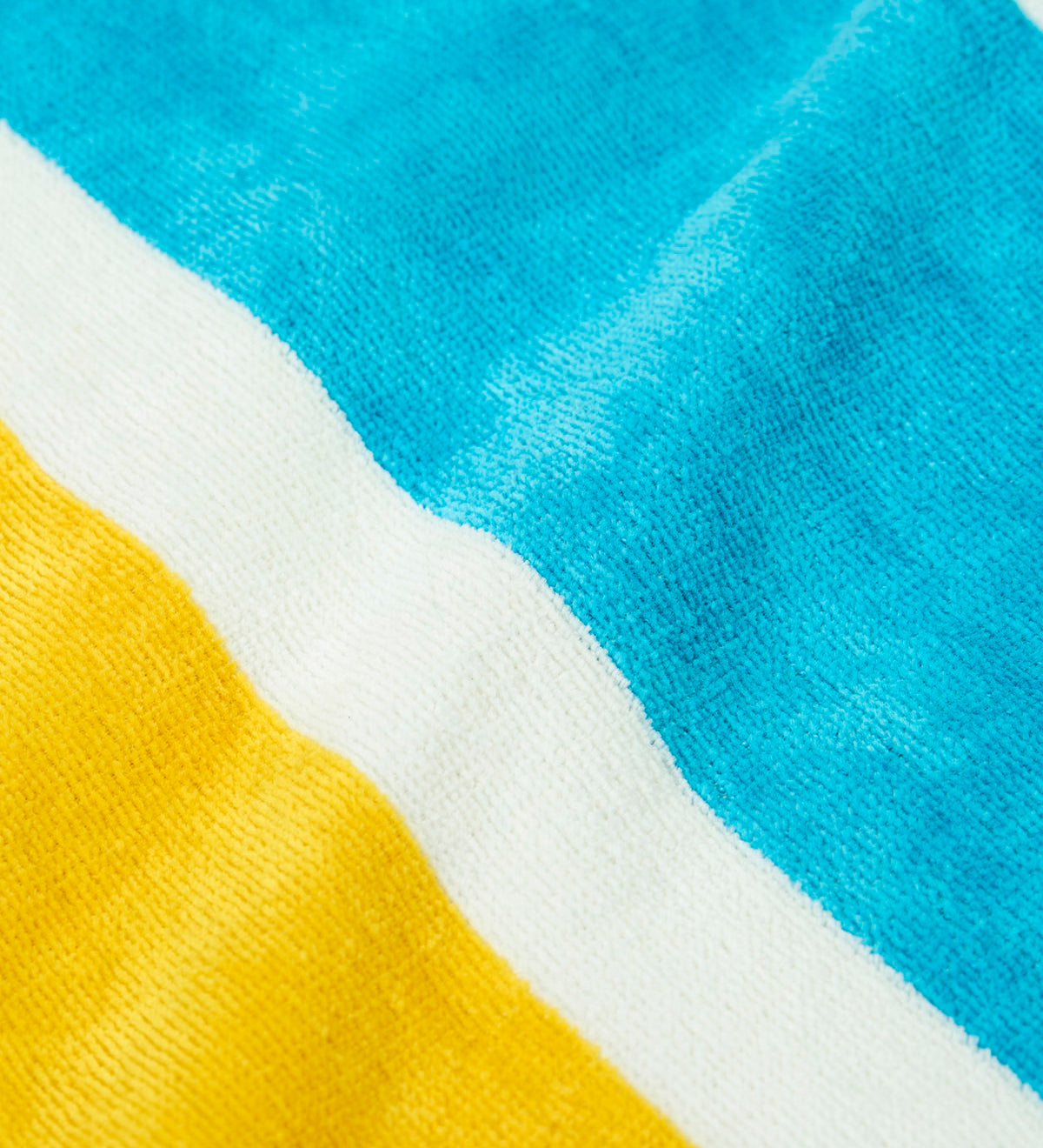 A close up of the Frugi towelling hooded swim towel showing the blue and yellow and white stripe design