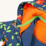 A closer look at the hood on the Frugi Snuggle Suit - Red Panda Pals. The image shows the inside of the hood with an orange lining and the red panda pattern on the front and sleeves of the snuggle suit