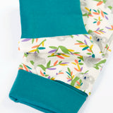 Frugi GOTS 100% organic cotton pyjama top in white with a a repeating koala print showing close up of the teal turn up cuffs