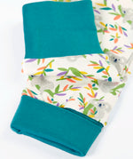Frugi GOTS 100% organic cotton pyjama top in white with a a repeating koala print showing close up of the teal turn up cuffs