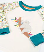 Frugi GOTS 100% organic cotton pyjama top in white with a sleeping koala applique on the front and teal turn up cuffs