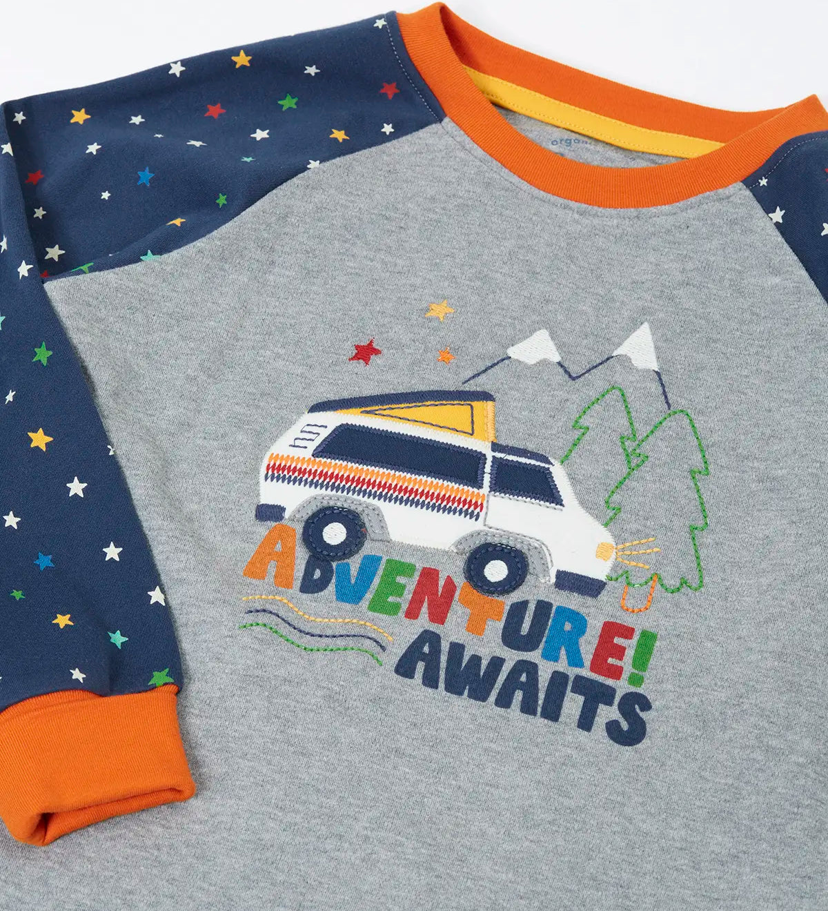 Frugi GOTS organic cotton jamie jim jams top showing a close up of the van applique on the front and navy with repeating stars 
