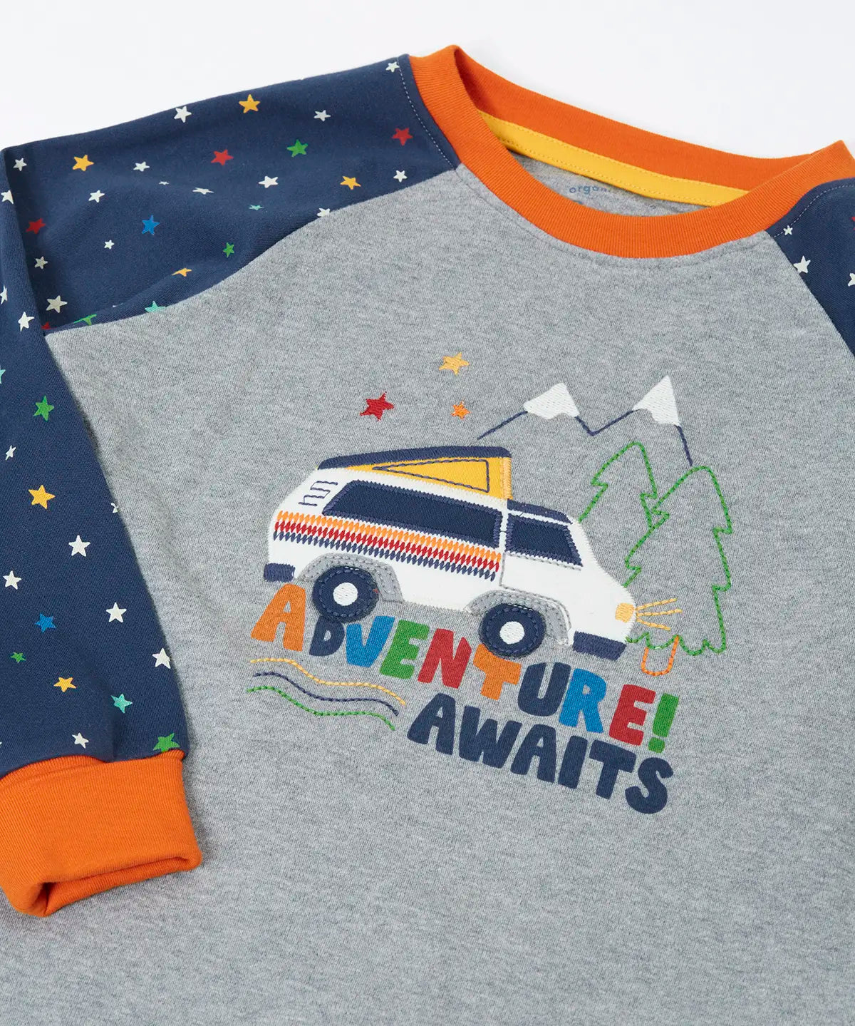 Frugi GOTS organic cotton jamie jim jams top showing a close up of the van applique on the front and navy with repeating stars 