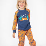 A child wearing the Frugi Jamie Jim Jams - Sleeping Tiger