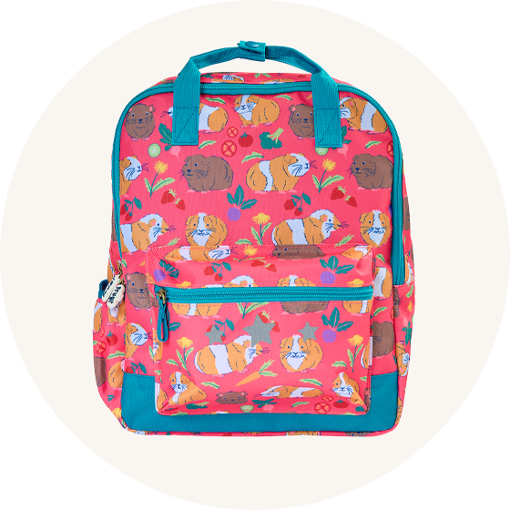 Frugi Explorers Backpack in pink with Guinea Pig Muddle print and blue zip and carry handle, to represent new Frugi bags and backpacks at Babipur.