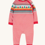 Frugi Lumi Knitted Romper - Fairisle Christmas Stripe, with a beautiful red and white stripe pattern, and a Christmas trees, house and star repeat pattern across the chest. Alos shown in the image are the bouttons for easy on and off changing.