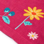 A closer look at the embroidered flower detail on the Frugi Coco Cord Dress - Lingonberry/Squirrel